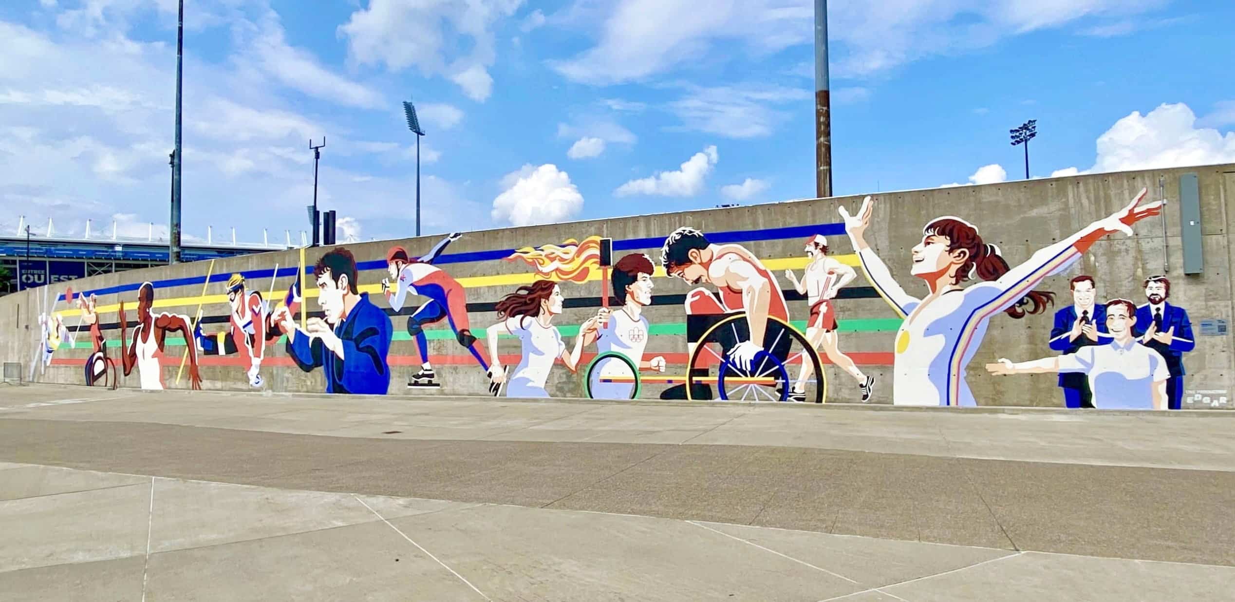 À l’occasion du 50e anniversaire des Jeux olympiques de 1976, le Conseil du sport de Montréal a dévoilé, le vendredi 31 juillet 2026, quatre murales sportives réalisées à différents endroits dans la métropole, dont celle-ci aux abords du Parc olympique.