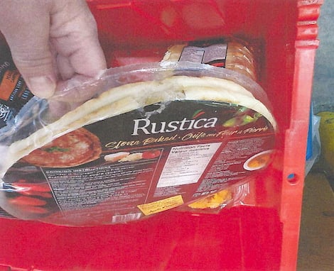 Walmart Bag of gnawed pizza crusts, with part of the contents, the size of a $2, eaten.