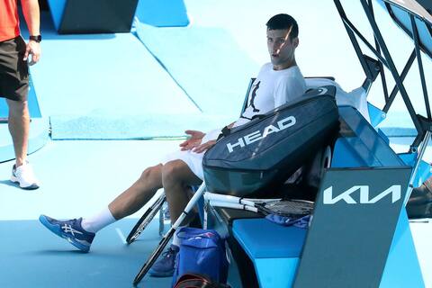 Djokovic trains at Australian Open, participation still pending
