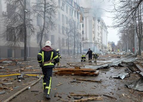 Firefighters are deployed at the National University of Economics in Kharkiv, damaged by Russian bombing.