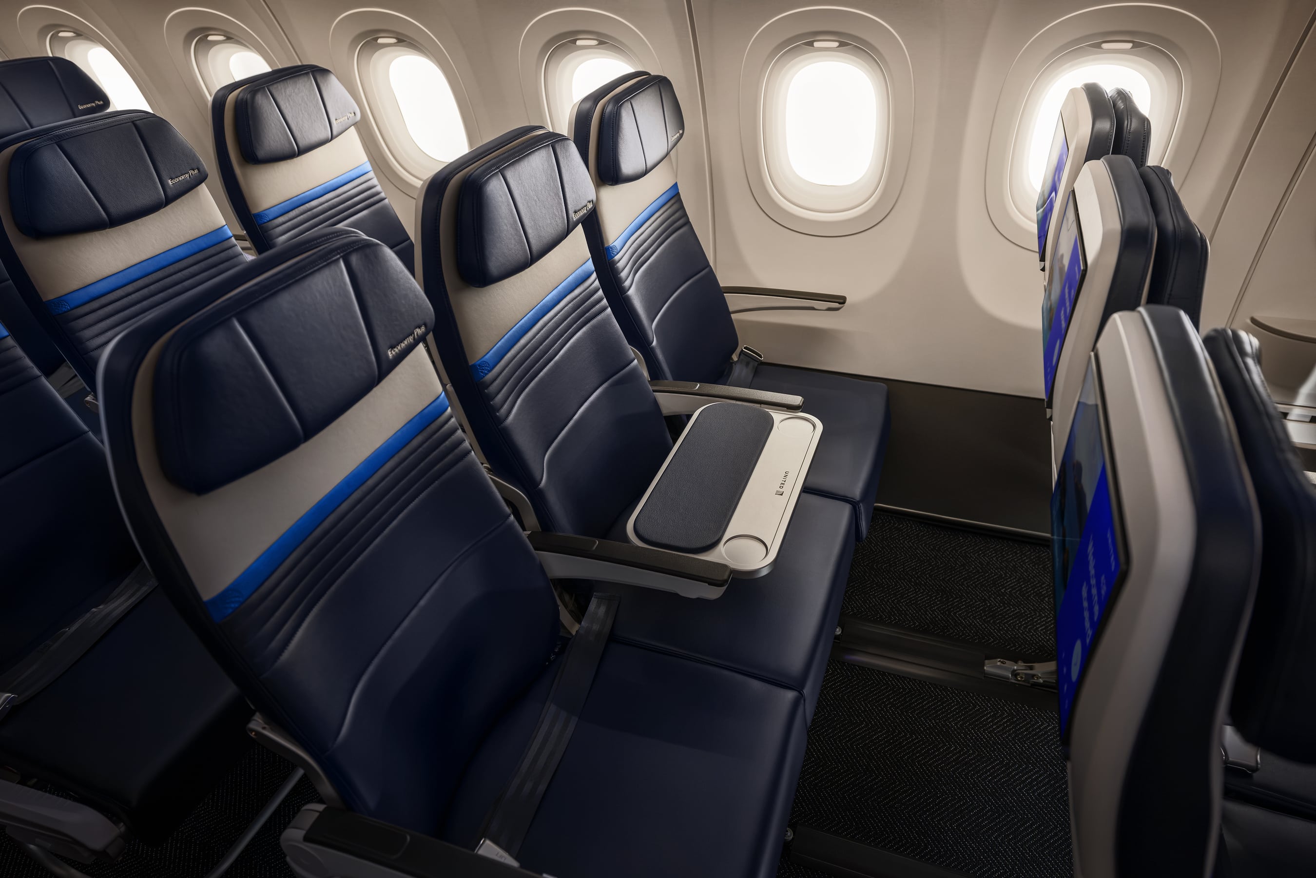 A row of Economy Plus class seats on a United Airlines plane.