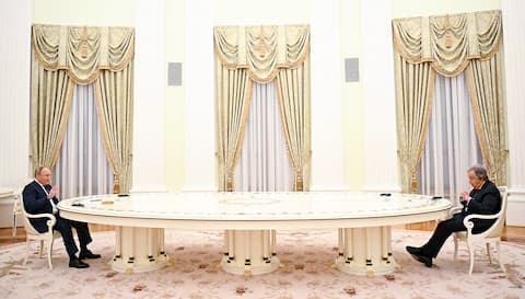 Russian President Vladimir Putin, left, received United Nations Secretary-General Antonio Guterres yesterday in Moscow at the end of his usual long table.