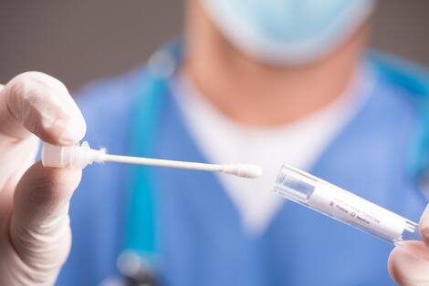 A Covid-19 test tube in hospital laboratory close up A Covid-19 test tube in hospital laboratory close up