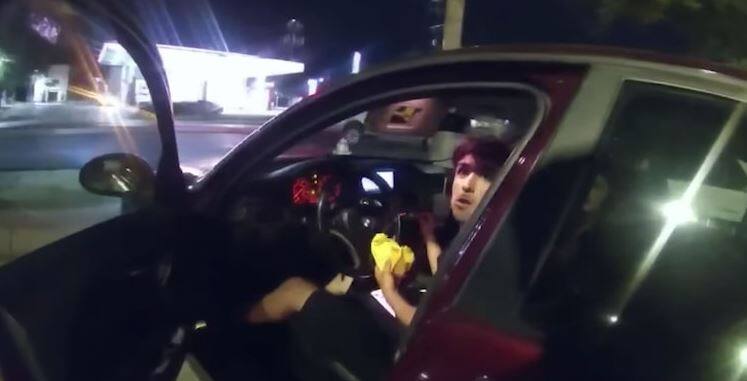 In the video |  Cop shoots teenager eating hamburger