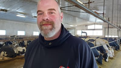 Jean Guilbert, a dairy producer from Saint-Maurice, opposes the TES Canada wind turbines which are regarding to flourish in his town.