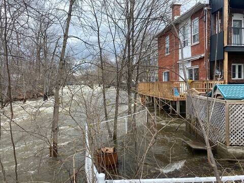 The powerful current of the North River crashes into the basement of a flooded apartment building.
