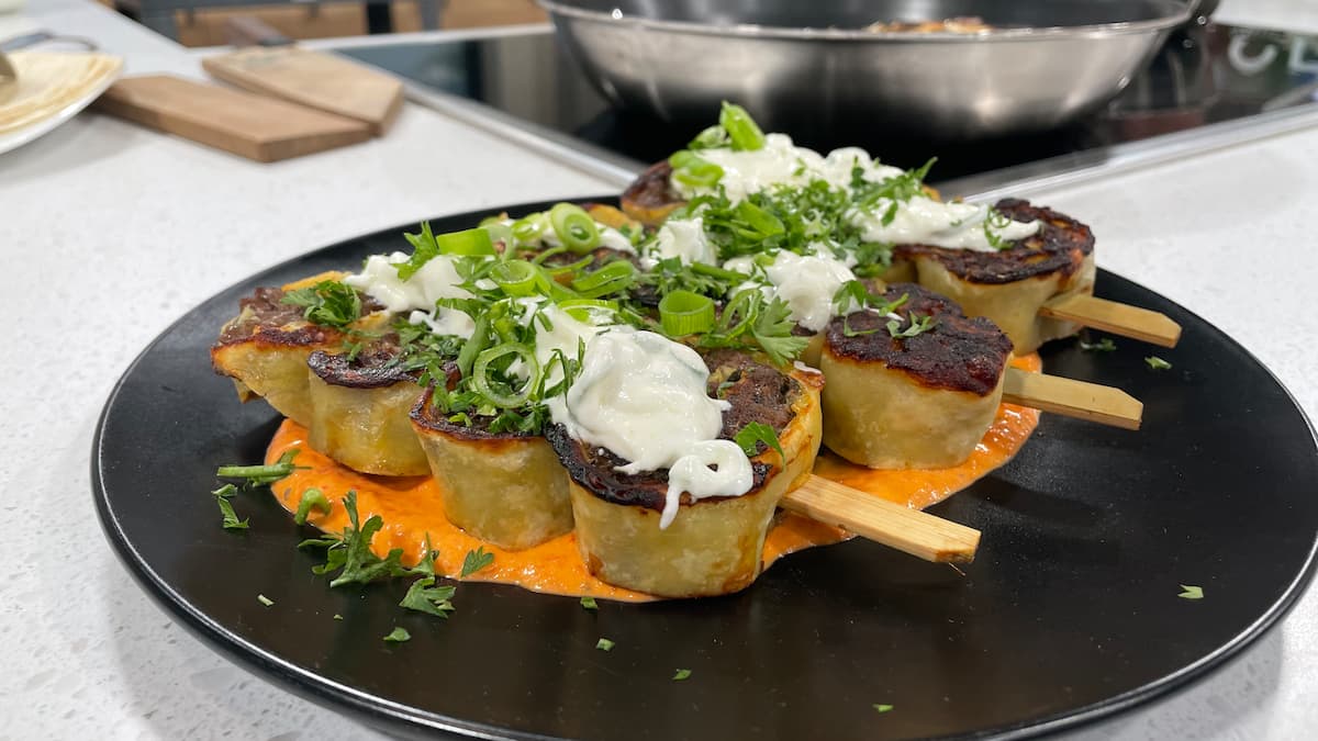 Arayes with pita bread, seasoned minced meat, garlic lemon sour cream sauce, and vegetable confit. Arayes with pita bread, seasoned minced meat, garlic lemon sour cream sauce, and vegetable confit.