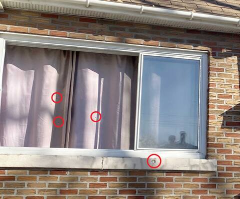A bedroom window was shattered by the gunshots, the effects of which can still be seen hovering.