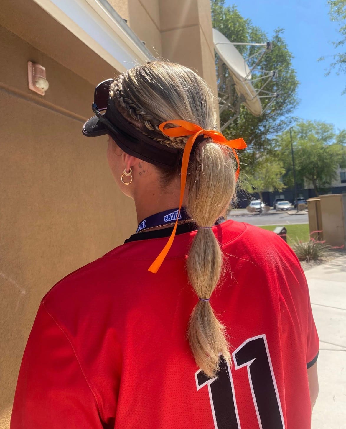 Noémye Letendre wearing an orange ribbon