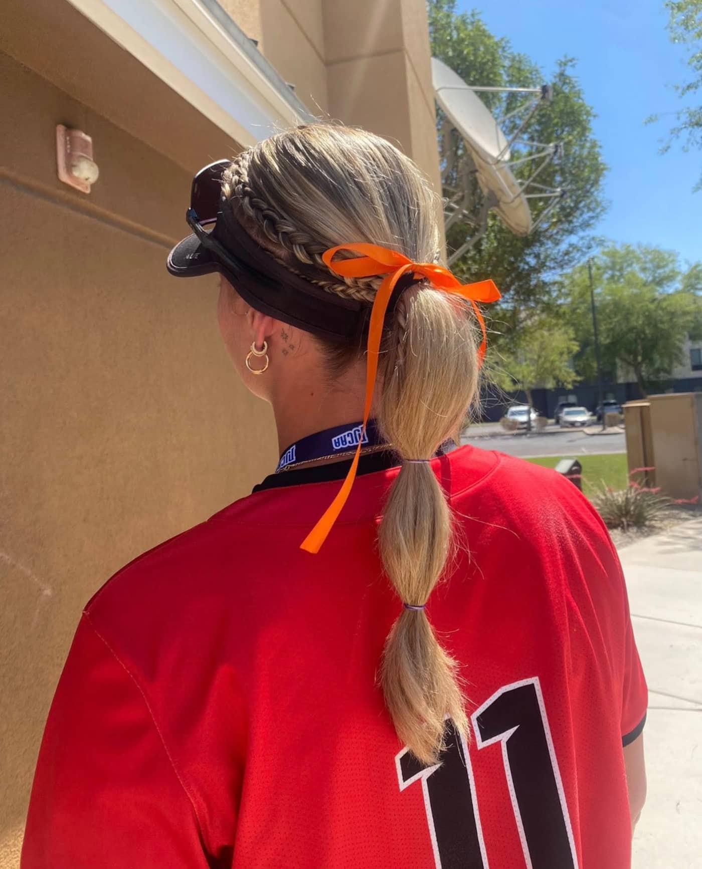 Noémye Letendre wearing an orange ribbon