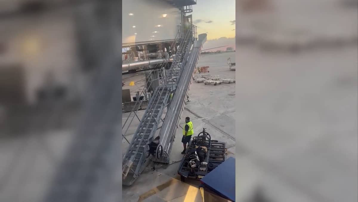 Wheelchair suddenly removed from plane by staff: American Airlines is investigating Wheelchair suddenly removed from plane by staff: American Airlines is investigating