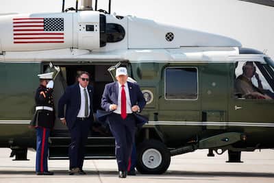 U.S. President Donald Trump walks onto Air Force One before leaving Bismarck Municipal Airport, July 1, 2026.
