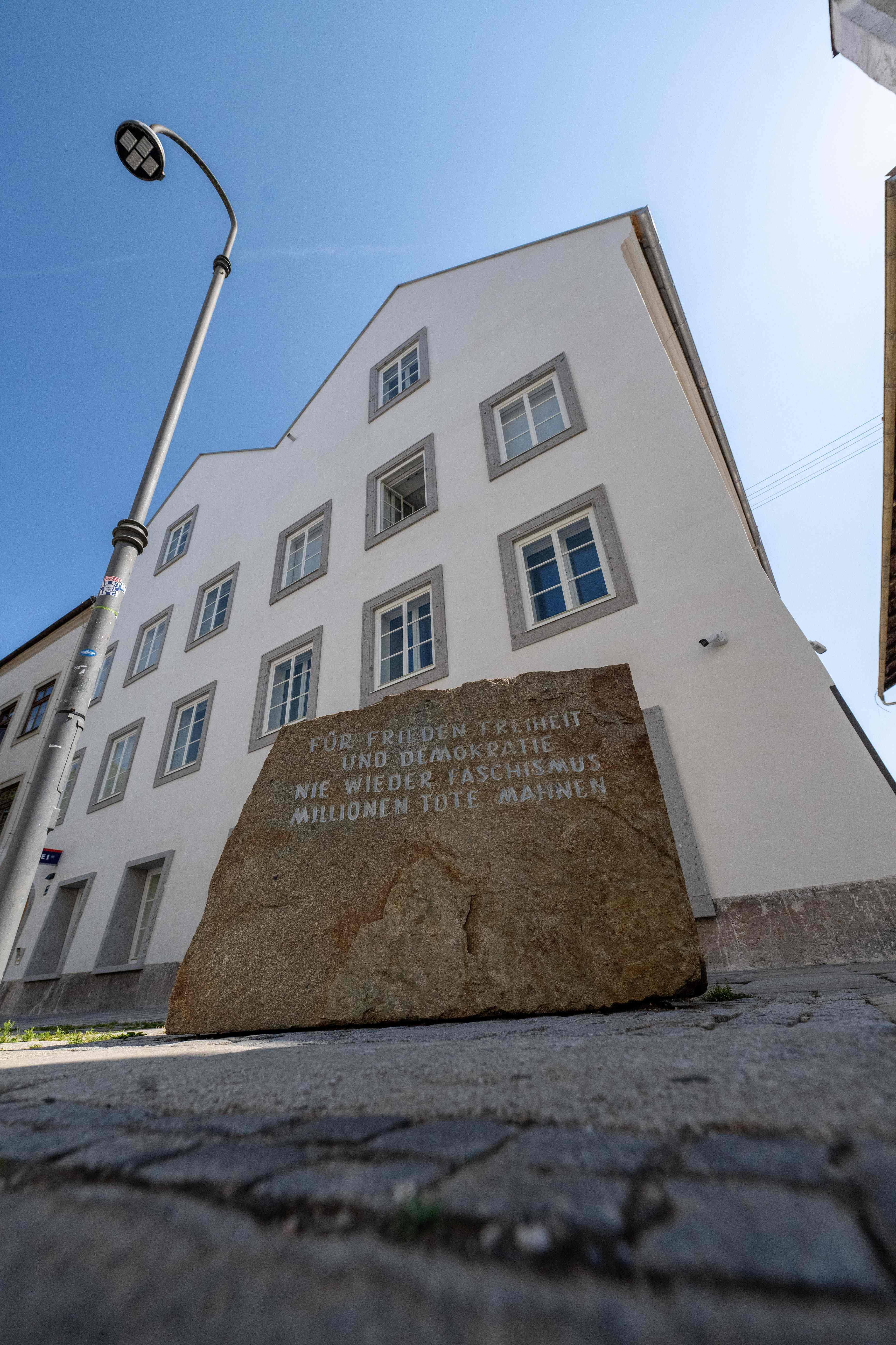 A memorial stone reading 
