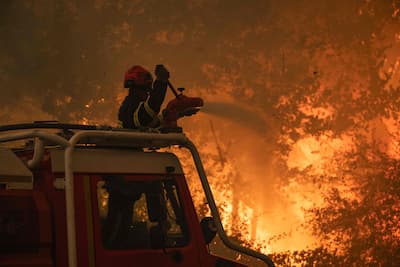 French firefighters trying to control the forest fire near Saumos and Sainte-Hélène, northwest of Bordeaux, in the Gironde department.