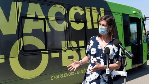 Patricia McKinnon (left), the regional director of immunization, gave Quebec Deputy Premier Genevieve Gilbolt a new vaccine-O-bus tour, praising her ingenious way to reach more people.