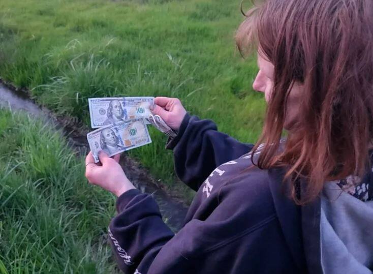 He throws 0,000 out of his car window and is arrested by the police