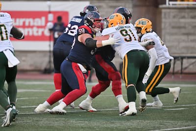Cyril Hogan-Saindon (number 59) against the Edmonton Elks in August.