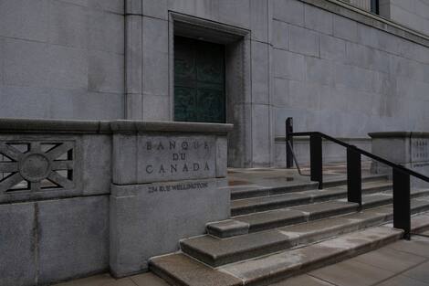 French signature of the Bank of Canada on the granite facade of the Canadian Bank. Concept of finance, monetary policy, economics, finance, interest rate, inflation, recession. French signature of the Bank of Canada on the granite facade of the Canadian Bank. Concept of finance, monetary policy, economics, finance, interest rate, inflation, recession.