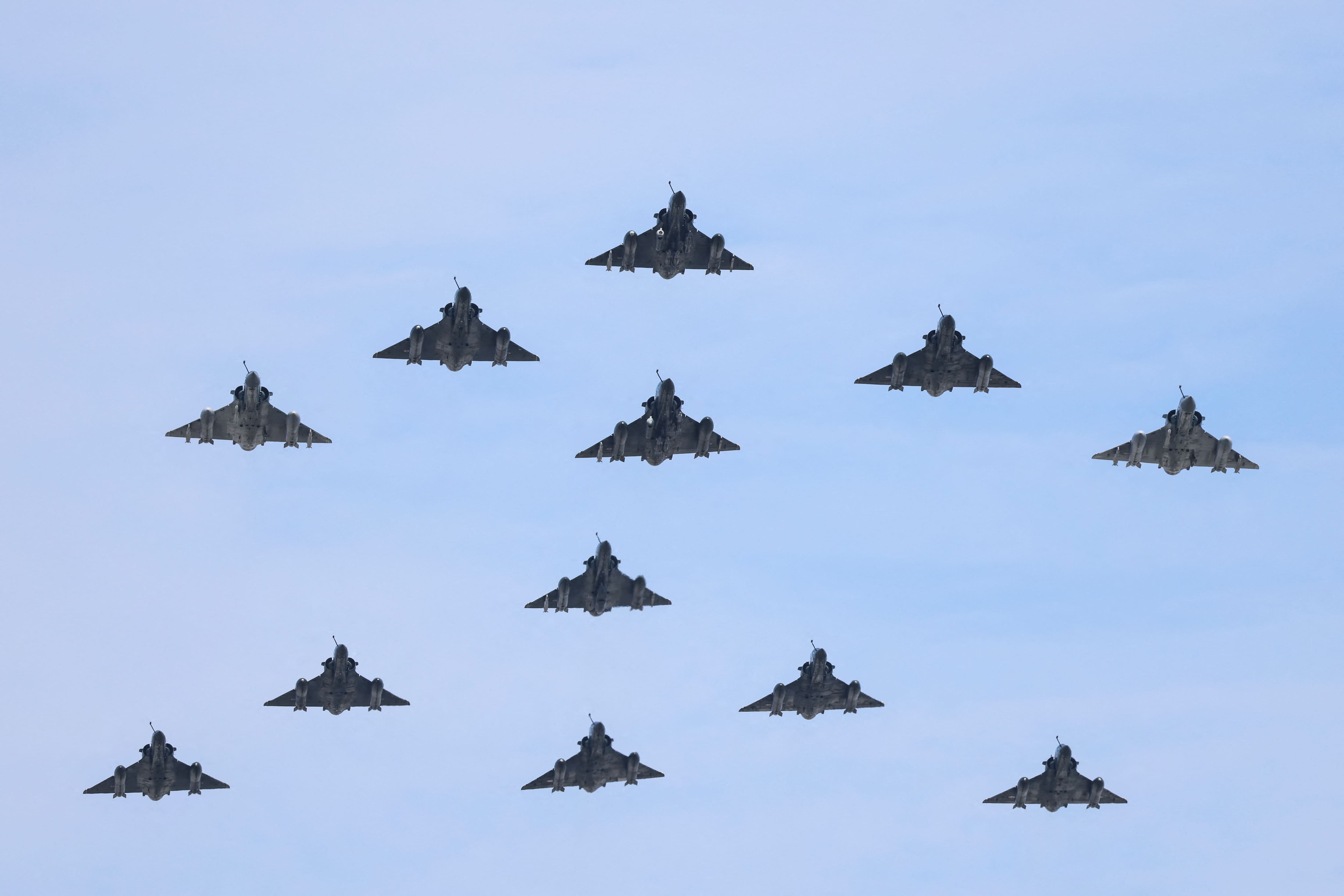 Mirage 2000D and 2000-5 aircraft from the French Air and Space Force perform a flypast during the annual Bastille Day military flypast over the Avenue des Champs-&Eacute;lys&eacute;es in Paris, July 14, 2026.