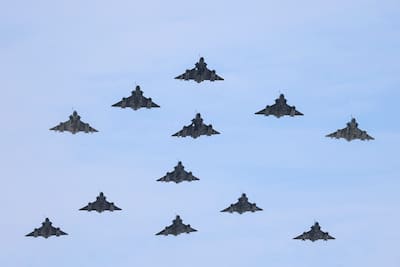 Mirage 2000D and 2000-5 aircraft from the French Air and Space Force perform a flypast during the annual Bastille Day military flypast over the Avenue des Champs-Élysées in Paris, July 14, 2026.