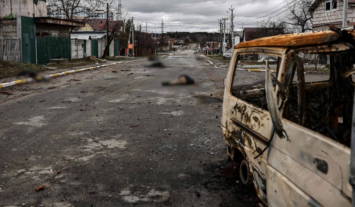 At least twenty corpses line a street in the now liberated city of Bautza