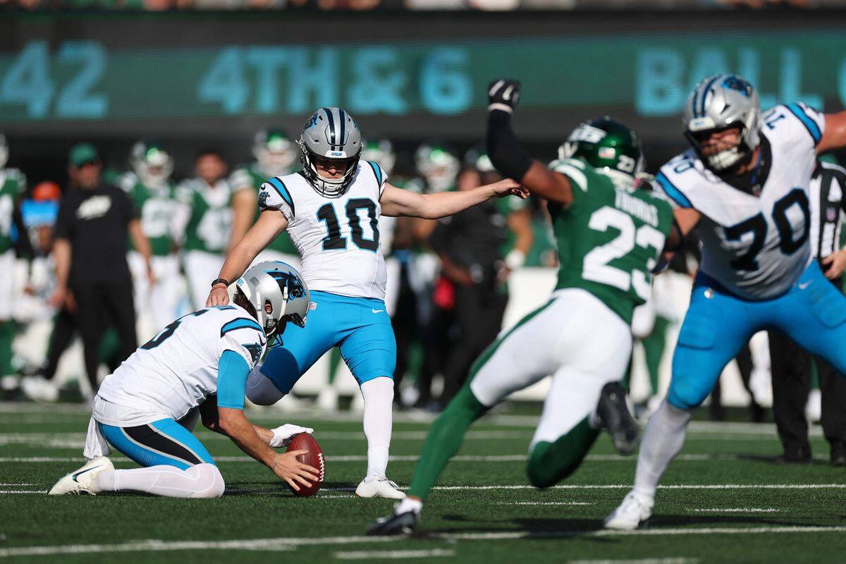 NFL kicker preparing for a long field goal attempt.