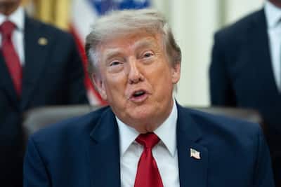United States President Donald J. Trump speaks to the press during a signing ceremony for an executive order to alter two Utah monuments, in the Oval Office of the White House in Washington, DC, U.S., Monday, July 13, 2026.