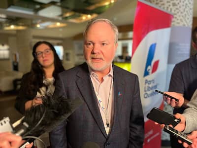 Interim Liberal leader Mark Tanguay during a press scrum on the last day of the PLQ General Assembly in the Promont.