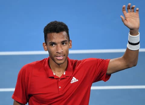 Felix Agar-Aliassim (right) of Canada and his team attend the trophy ceremony after defeating Roberto Bautista of Spain in their last men's singles match of the 2022 ATP Cup match between Spain and Canada in Sydney on January 9, 2022.