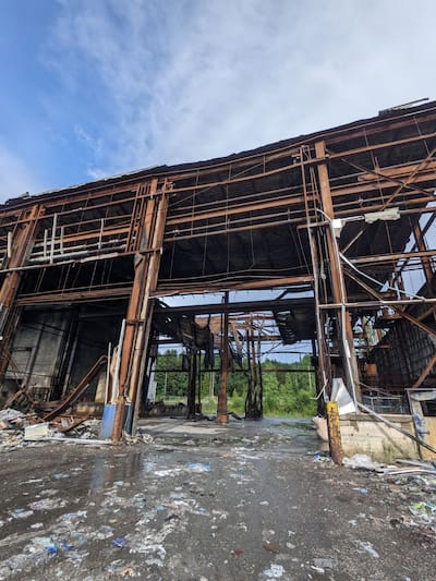 Several boxes including syringes, solutions, surgical masks, latex gloves and masks are stored in a dilapidated building in Val-des-Sources for recycling purposes.
