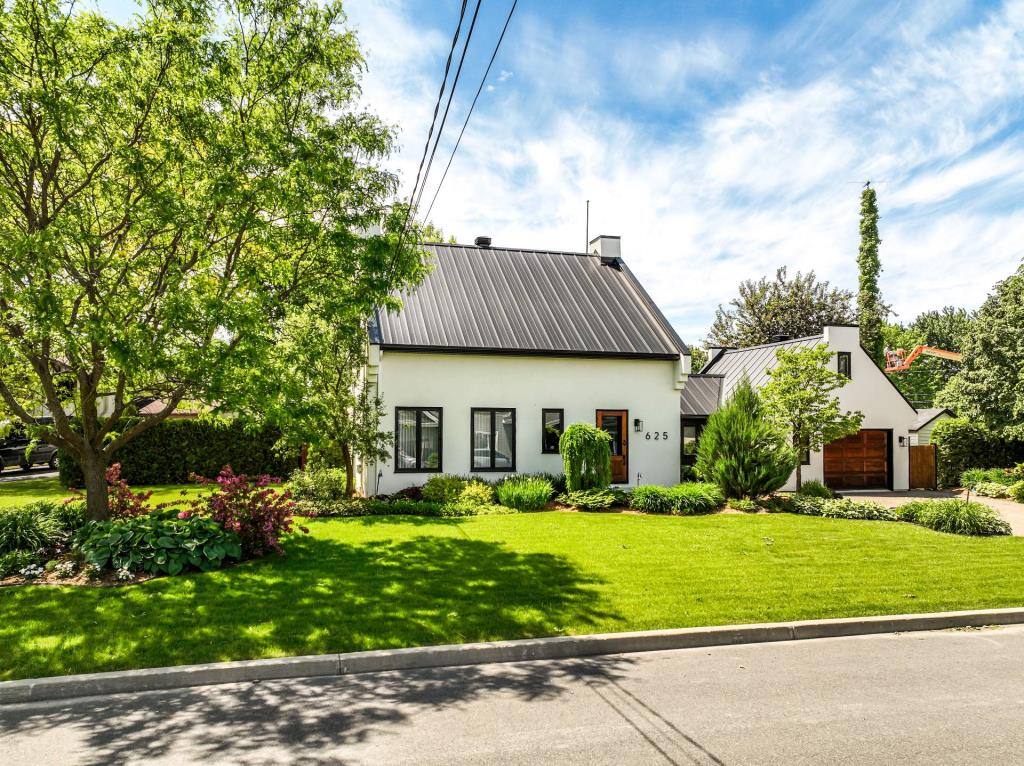 Une chaleureuse maison à vendre pour 975 000$