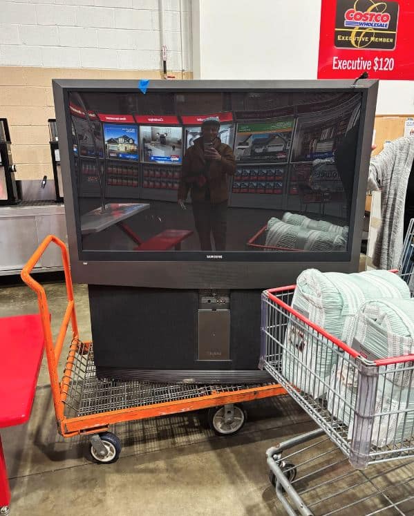 In the photo A customer returns a 2002 television to Costco