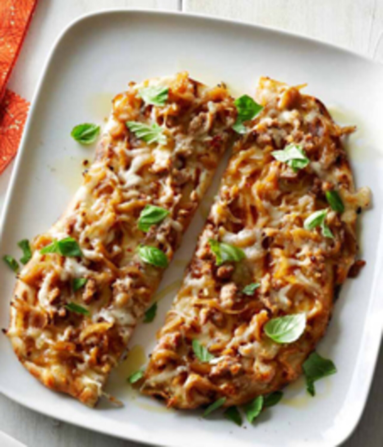 Recipe Grilled flatbreads with caramelized onions, sausage and cheese